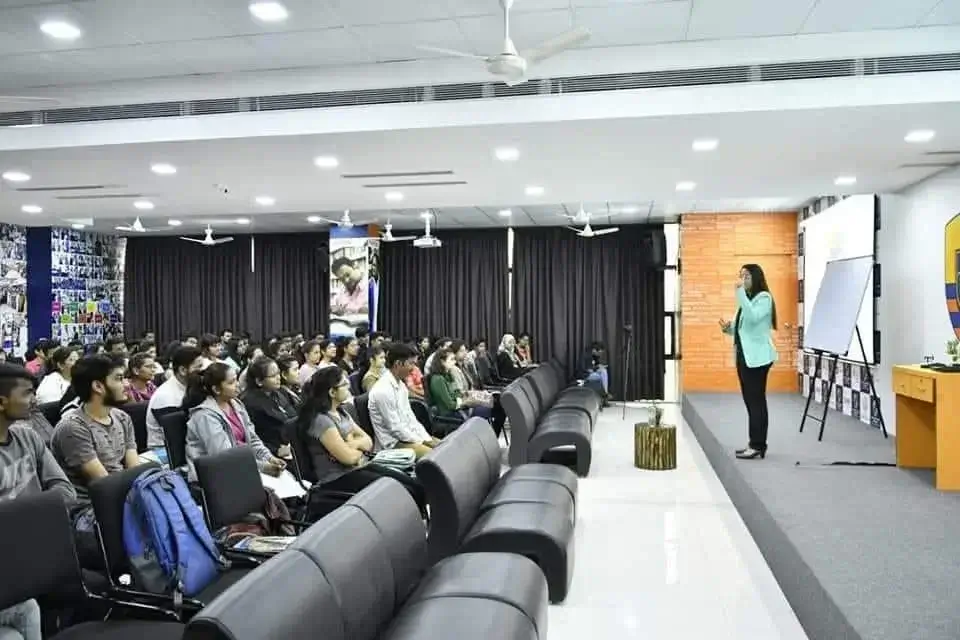Richa Gandhi presenting to a live audience